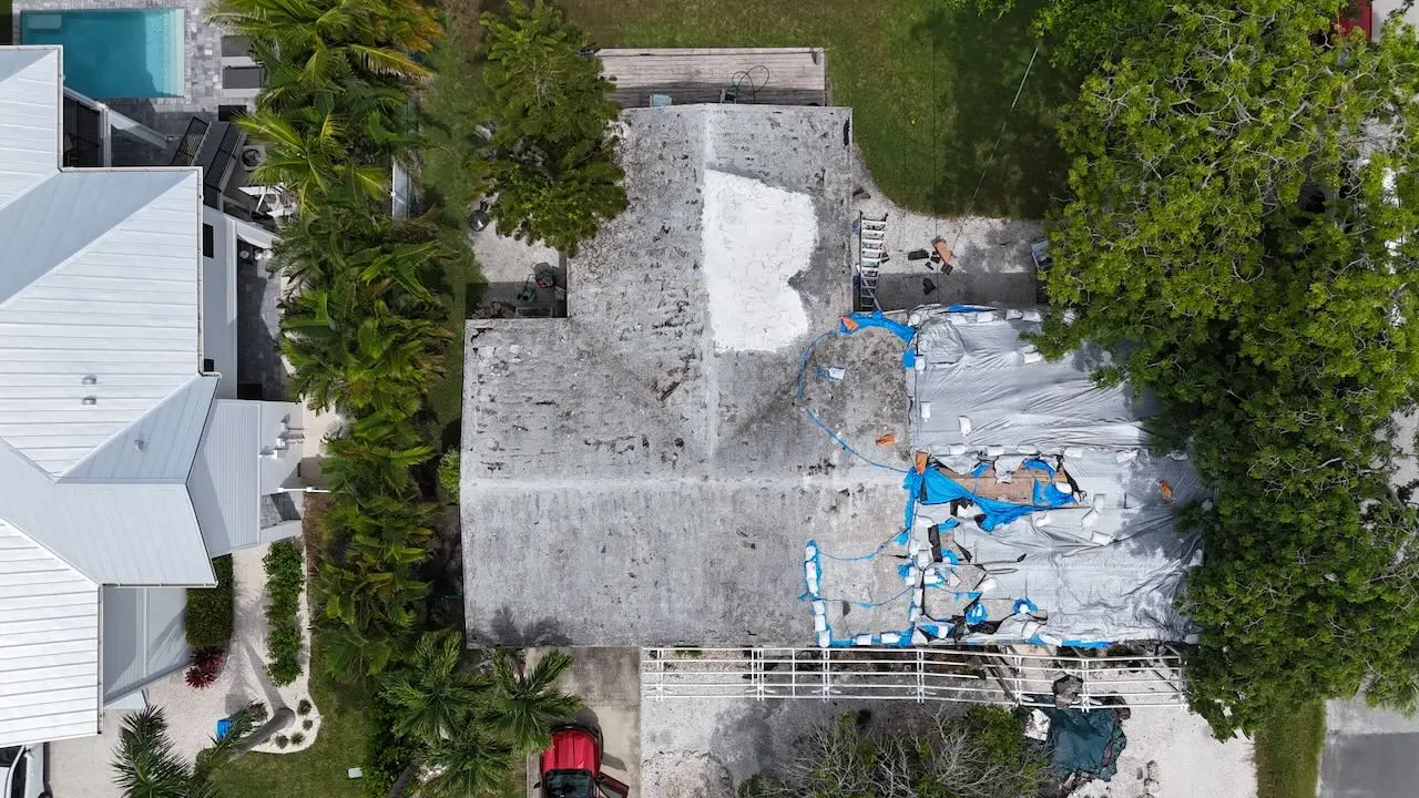 Picture showing before of before and after a metal roof replacement